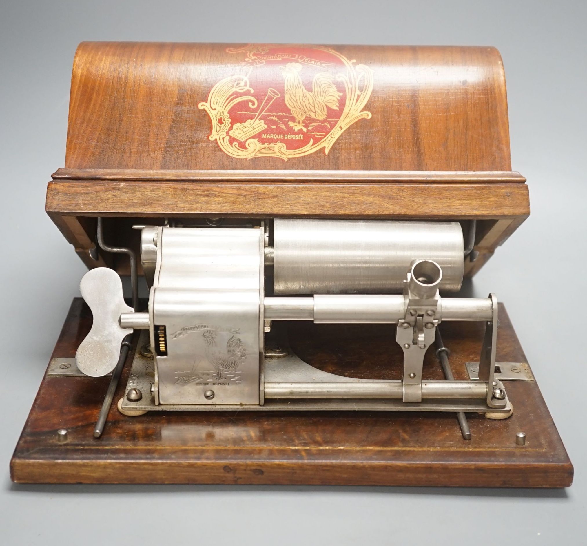 A Charles Pathé' cased phonograph, with separate aluminium horn, 30 cms wide.